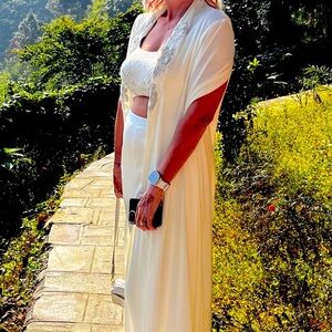 White outfit made by designer Zari Zara.  Haldi design.